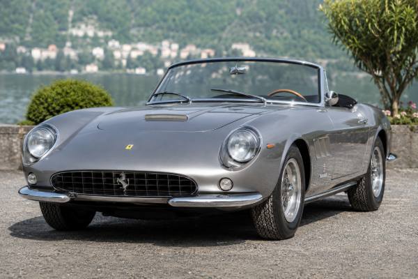Ferrari 275 GTS Tipo 563 specs, 260 hp Colombo V12, rear transaxle, independent suspension, performance, history, and buyer guide.