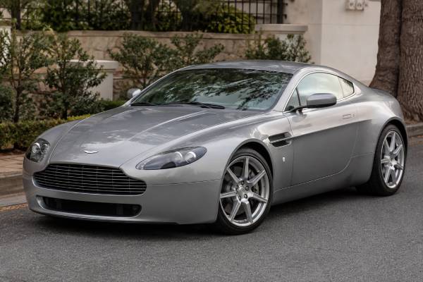 Aston Martin V8 Vantage specs: 4.3L naturally aspirated V8, 380 hp, 410 Nm, six-speed manual, 4.9-sec 0–60 mph, and 175 mph top speed.
